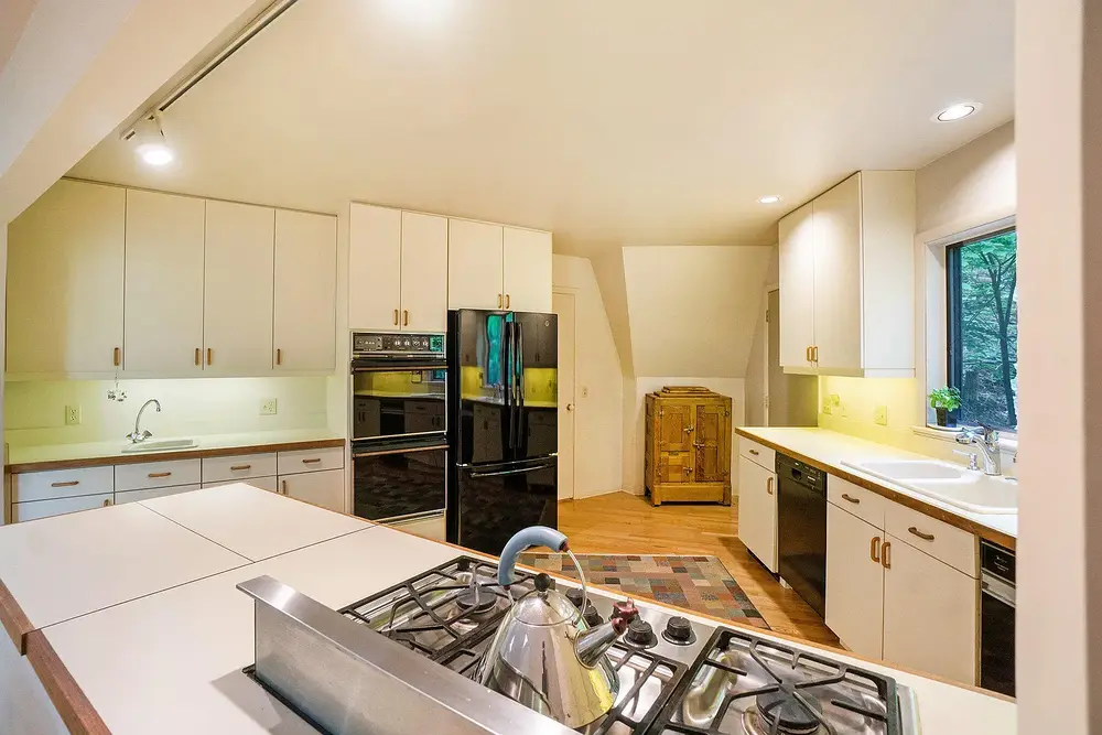 Covered patio and walking path through forest at Silver Lake Dome property