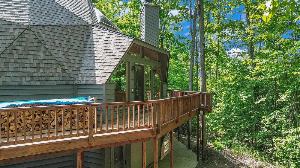 Side view of geodesic dome rental with wraparound deck in Indian River Michigan