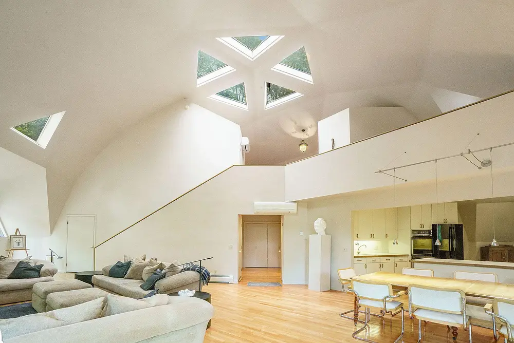 Open living area with dramatic dome skylights